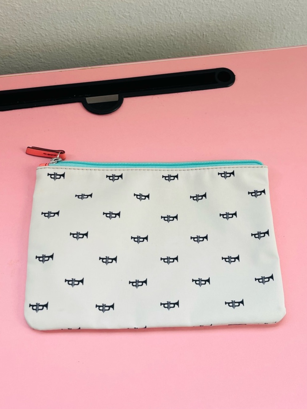 Fossil White Cosmetic Pouch with Navy Trumpet Print and Turquoise Zipper